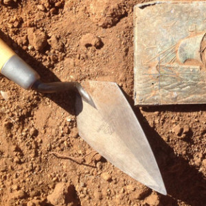 vintage decorative metal box found in dirt