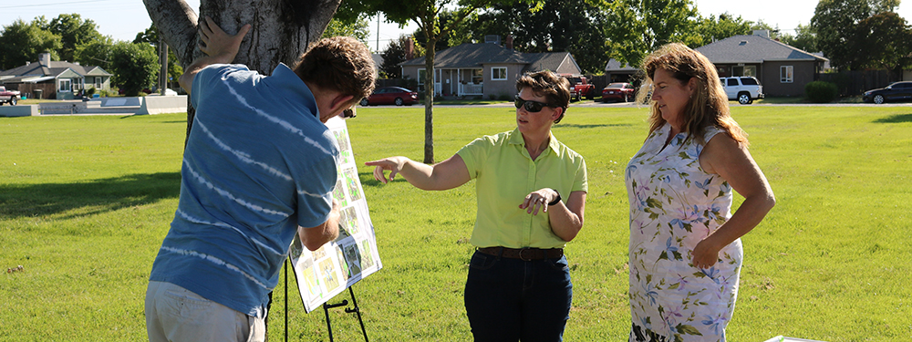 Landscape architect pointing to park plan during public outreach event